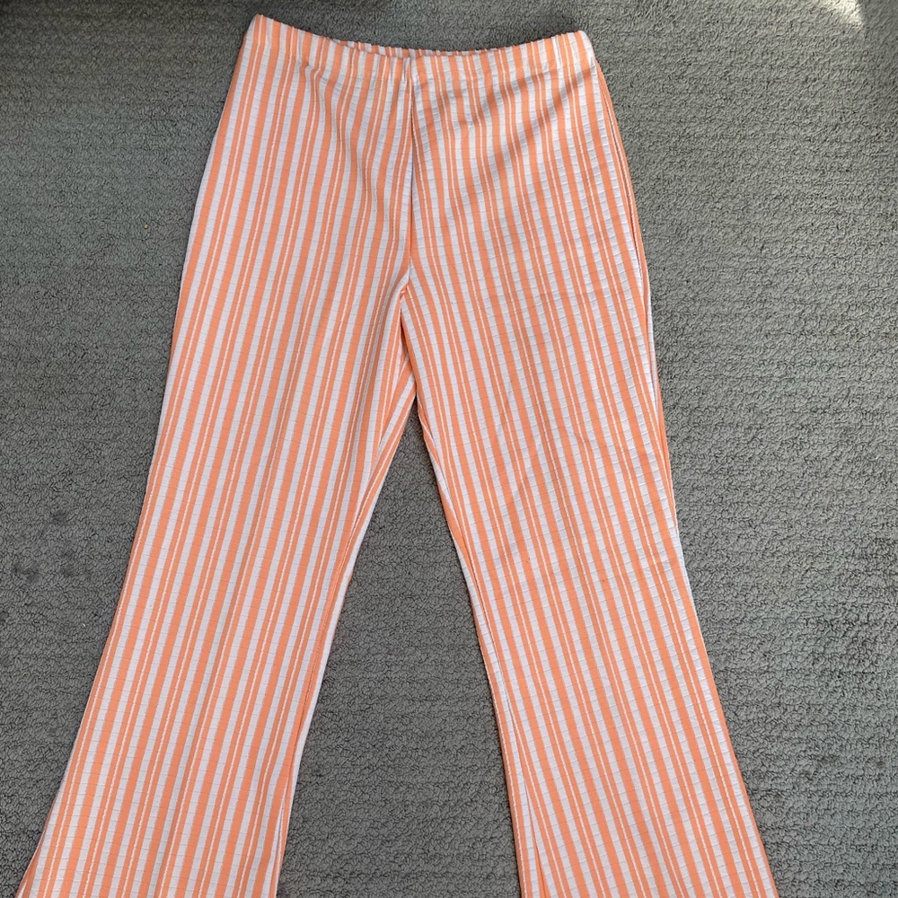 Striped bell bottoms. Orange and white